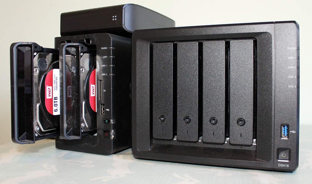 A Synology DS214play next to a Synology DS418
