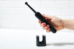 person holding black electronic device