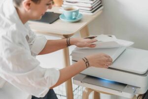 woman preparing paper for printing photos