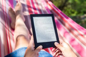 person reading story on Amazon Kindle